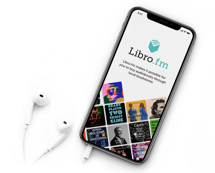 Libro.fm Audiobook app promotion on device with headphones